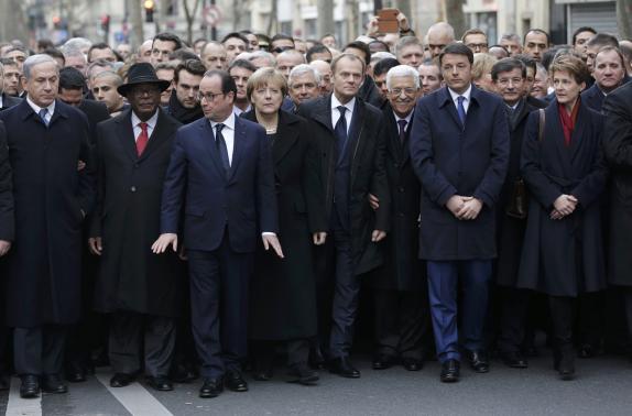 French President Francois Hollande is surrounded by Heads of state including (LtoR) Israel's Prime Minister Benjamin Netanyahu, Mali's President Ibrahim Boubacar Keita, Germany's Chancellor Angela Merkel, European Council President Donald Tusk, Palestinian President Mahmoud Abbas, Italy's Prime Minister Matteo Renzi and Switzerland's President Simonetta Sommaruga as they attend the solidarity march (Marche Republicaine) in the streets of Paris January 11, 2015. REUTERS/Philippe Wojazer