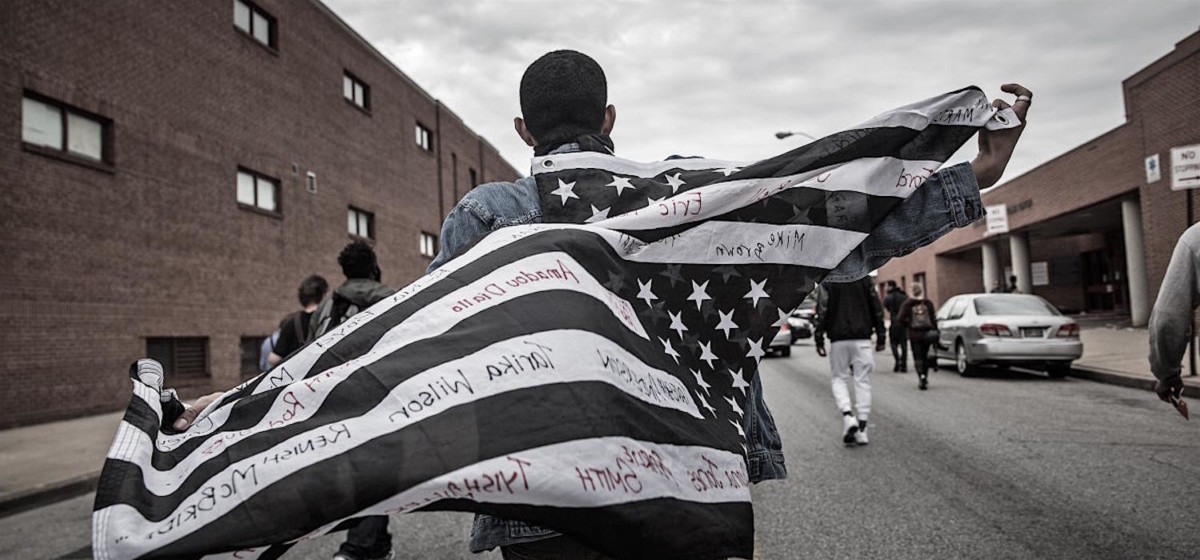 BALTIMORE, MD - MAY 01:  Protesters march through the streets in support of Maryland state attorney Marilyn Mosby's announcement that charges would be filed against Baltimore police officers in the death of Freddie Gray on May 1, 2015 in Baltimore, Maryland. Gray died in police custody after being arrested on April 12, 2015.  (Photo by Andrew Burton/Getty Images)