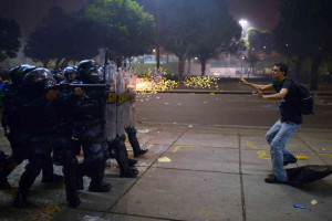 A demonstrator is shot by a rubber bullet during a protest Thursday in Rio de Janeiro