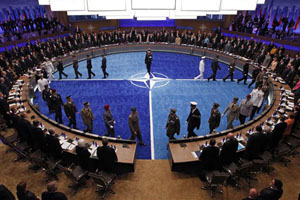 Leaders watch a ceremony honoring NATO military personnel for their service the NATO Summit meeting in Chicago