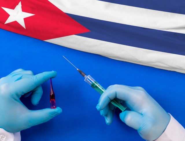 Cuba,Vaccination.,Hands,Of,Doctor,Holding,Syringe,And,Coronavirus,(covid-19)