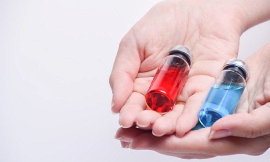 concept-choice-treatment-close-up-woman-hands-holding-two-vial-ampouleb