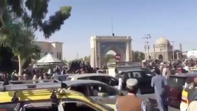 People gather near Kandahar city gate in the Eid Gah Darwaza area