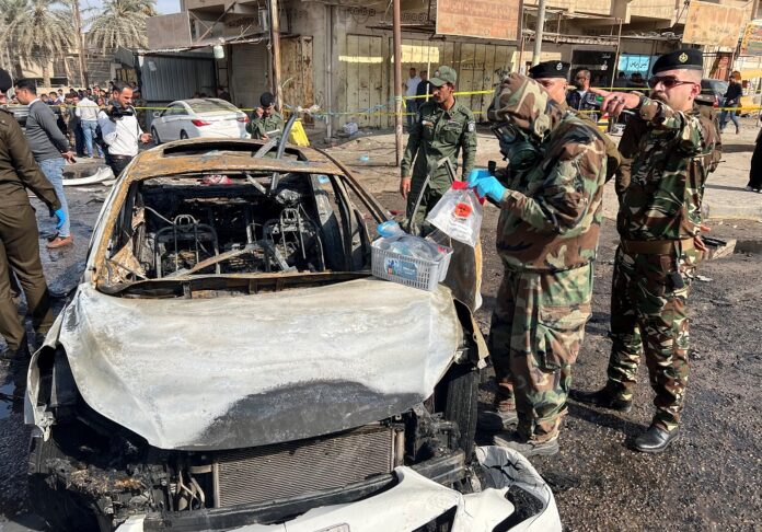 Iraqi security forces inspect site of explosion in Basra