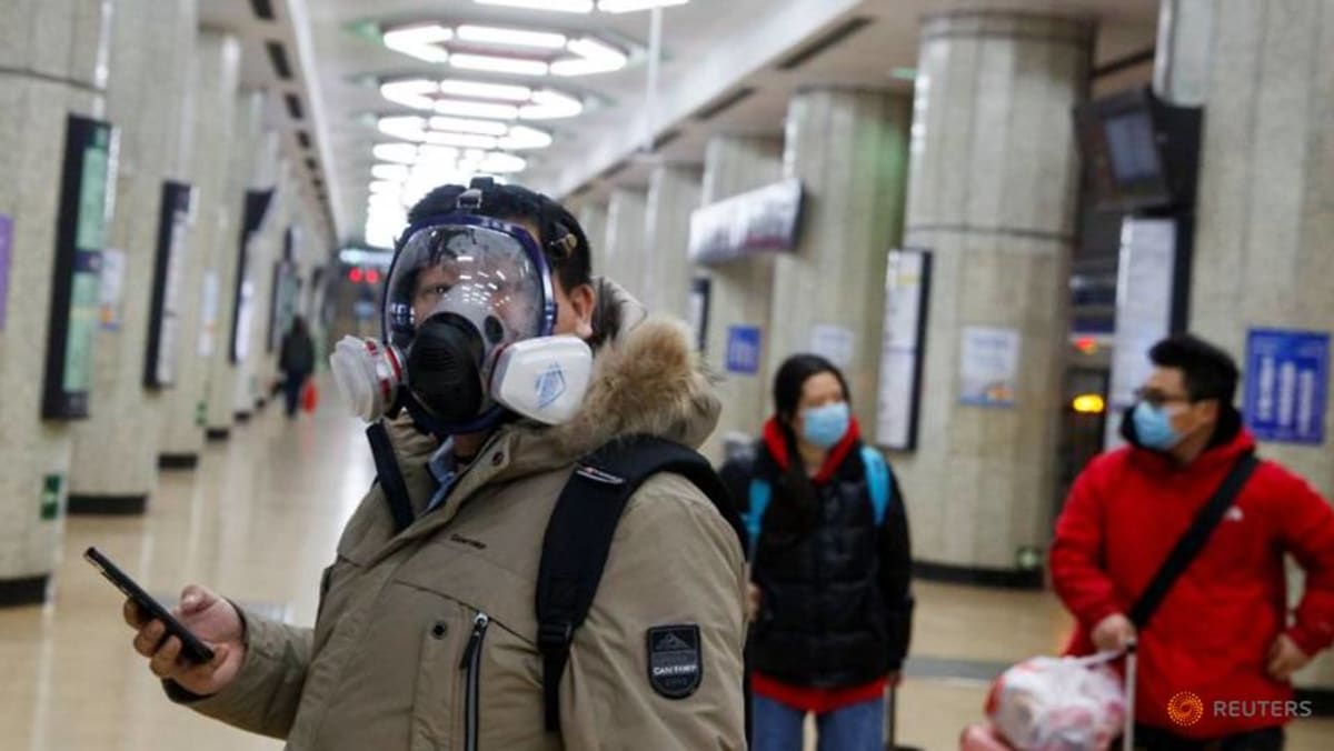a-man-wears-a-face-mask-at-a-metro-station-in-beijing-as-the-country-is-hit-by-an-outbreak-of-the-novel-coronavirus-9