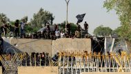 Supporters of Iraqi populist leader Moqtada al-Sadr protest at the Green Zone, in Baghdad