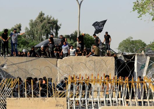 Supporters of Iraqi populist leader Moqtada al-Sadr protest at the Green Zone, in Baghdad