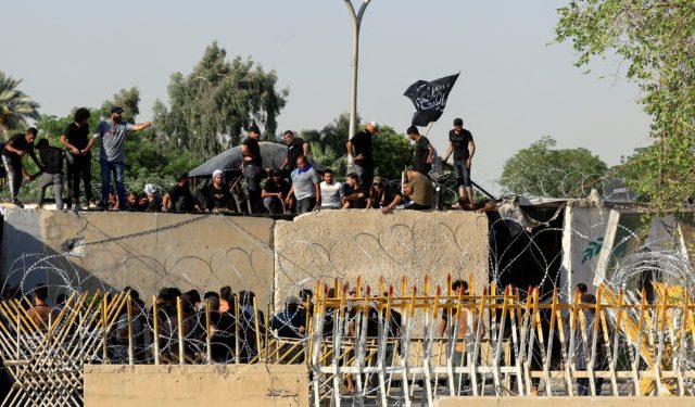 Supporters of Iraqi populist leader Moqtada al-Sadr protest at the Green Zone, in Baghdad