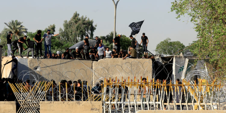 Supporters of Iraqi populist leader Moqtada al-Sadr protest at the Green Zone, in Baghdad