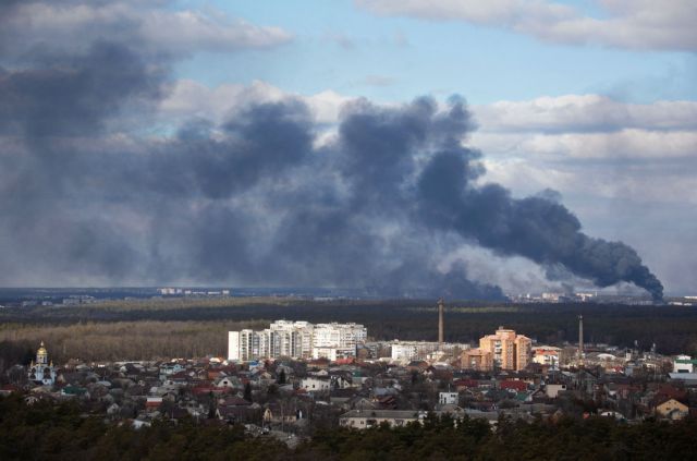 Smoke rising after shelling on the outskirts of the city is pictured from Kyiv