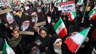 Iranian pro-government protesters attend a demonstration in Tehran
