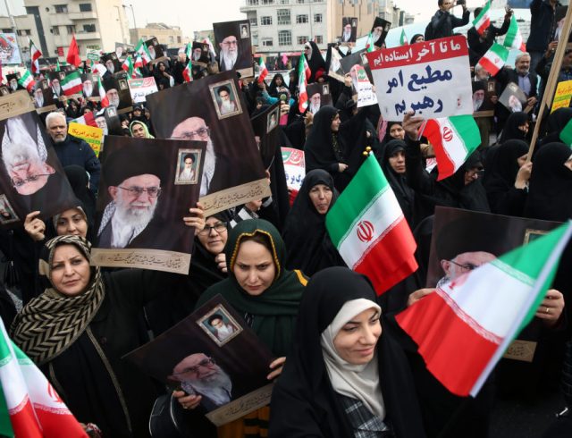 Iranian pro-government protesters attend a demonstration in Tehran