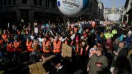 Workers take part in a strike, in London