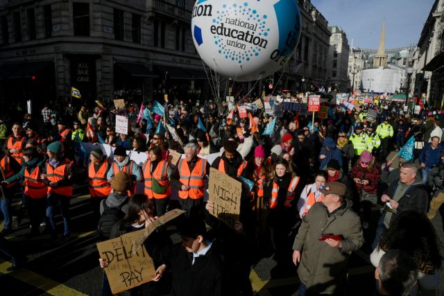 Workers take part in a strike, in London