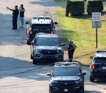 Law enforcement members guard the perimeter of the home of Trump shooting suspect, in Bethel Park