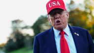 U.S. President Donald Trump returns at the White House, in Washington