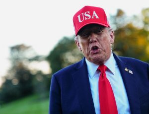 U.S. President Donald Trump returns at the White House, in Washington