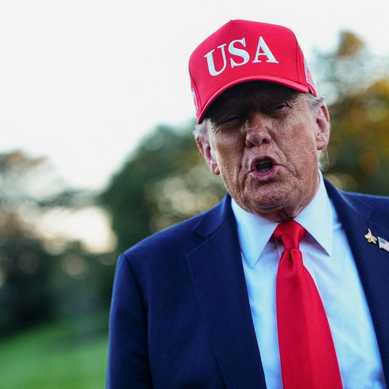 U.S. President Donald Trump returns at the White House, in Washington