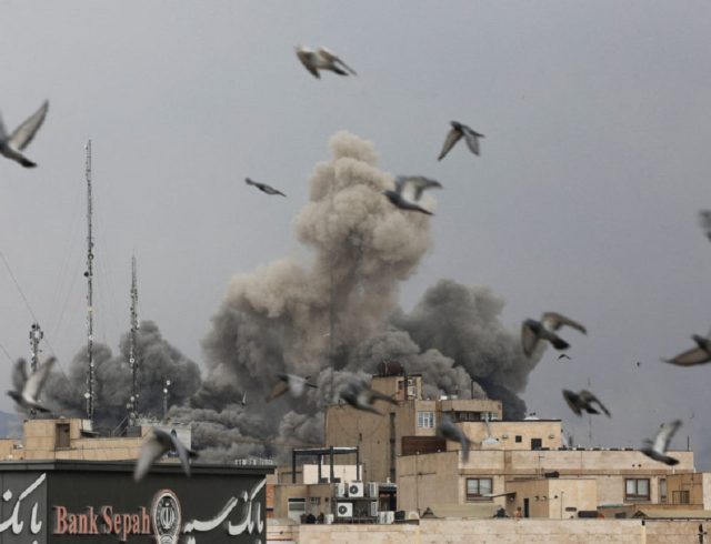 Smoke rises following an explosion, after Israel and the U.S. launched strikes on Iran, in Tehran