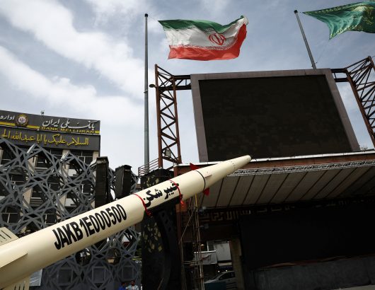 A symbolic mockup of an Iranian missile is displayed in Tehran