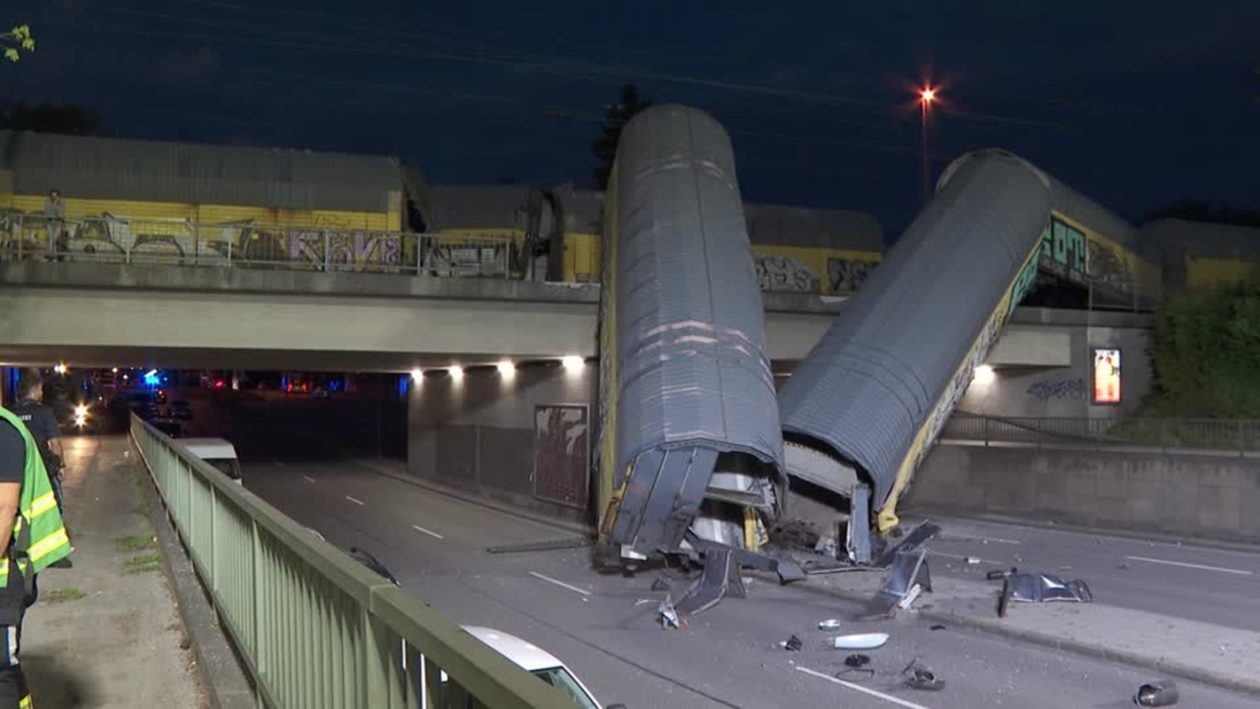 One person seriously injured after freight train partially goes over bridge