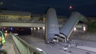 One person seriously injured after freight train partially goes over bridge