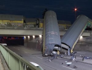 One person seriously injured after freight train partially goes over bridge