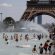 People cool off in the Trocadero fountains across from the Eiffel Tower in Paris as a heatwave hit much of the country
