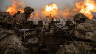 Ukrainian servicemen fire an anti-aircraft gun towards Russian positions on a frontline near the town of Bakhmut
