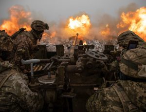 Ukrainian servicemen fire an anti-aircraft gun towards Russian positions on a frontline near the town of Bakhmut